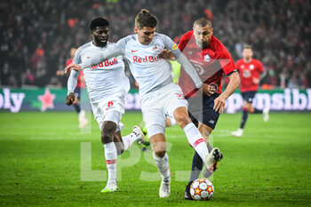 2021-11-23 - Jerome ONGUENE of RB Salzbourg, Maximilian WOBER of RB Salzbourg and Burak YILMAZ of Lille during the UEFA Champions League, Group G football match between Lille LOSC and FC Salzburg on November 23, 2021 at Pierre Mauroy stadium in Villeneuve-d'Ascq near Lille, France - LILLE LOSC VS FC SALZBURG - UEFA CHAMPIONS LEAGUE - SOCCER