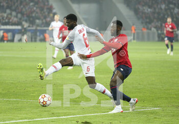 2021-11-23 - Jerome Onguene of RB Salzburg, Jonathan Bamba of Lille during the UEFA Champions League, Group G football match between Lille OSC (LOSC) and FC RB Salzburg on November 23, 2021 at Pierre Mauroy stadium in Villeneuve-d'Ascq near Lille, France - LILLE LOSC VS FC SALZBURG - UEFA CHAMPIONS LEAGUE - SOCCER