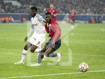 2021-11-23 - Jonathan Bamba of Lille, Jerome Onguene of RB Salzburg (left) during the UEFA Champions League, Group G football match between Lille OSC (LOSC) and FC RB Salzburg on November 23, 2021 at Pierre Mauroy stadium in Villeneuve-d'Ascq near Lille, France - LILLE LOSC VS FC SALZBURG - UEFA CHAMPIONS LEAGUE - SOCCER