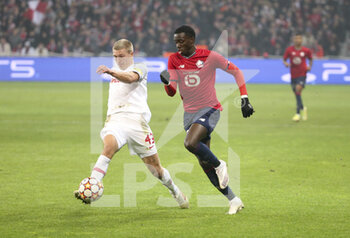 2021-11-23 - Rasmus Kristensen of RB Salzburg, Timothy Weah of Lille during the UEFA Champions League, Group G football match between Lille OSC (LOSC) and FC RB Salzburg on November 23, 2021 at Pierre Mauroy stadium in Villeneuve-d'Ascq near Lille, France - LILLE LOSC VS FC SALZBURG - UEFA CHAMPIONS LEAGUE - SOCCER