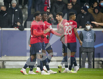 2021-11-23 - Jonathan David of Lille celebrates his goal with Timothy Weah during the UEFA Champions League, Group G football match between Lille OSC (LOSC) and RB Salzburg on November 23, 2021 at Pierre Mauroy stadium in Villeneuve-d'Ascq near Lille, France - LILLE LOSC VS FC SALZBURG - UEFA CHAMPIONS LEAGUE - SOCCER
