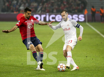 2021-11-23 - Andreas Ulmer of RB Salzburg, Mehmet Zeki Celik of Lille (left) during the UEFA Champions League, Group G football match between Lille OSC (LOSC) and FC RB Salzburg on November 23, 2021 at Pierre Mauroy stadium in Villeneuve-d'Ascq near Lille, France - LILLE LOSC VS FC SALZBURG - UEFA CHAMPIONS LEAGUE - SOCCER