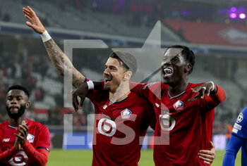 2021-11-23 - Jose Fonte, Amadou Onana of Lille celebrate the victory following the UEFA Champions League, Group G football match between Lille OSC (LOSC) and FC RB Salzburg on November 23, 2021 at Pierre Mauroy stadium in Villeneuve-d'Ascq near Lille, France - LILLE LOSC VS FC SALZBURG - UEFA CHAMPIONS LEAGUE - SOCCER