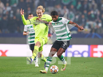 2021-11-24 - Matheus Reis of Sporting Lisbon and Julian Brandt of Borussia Dortmund during the UEFA Champions League, Group C football match between Sporting Lisbon and Borussia Dortmund on November 24, 2021 at Jose Alvalade stadium in Lisbon, Portugal - SPORTING LISBON VS BORUSSIA DORTMUND - UEFA CHAMPIONS LEAGUE - SOCCER
