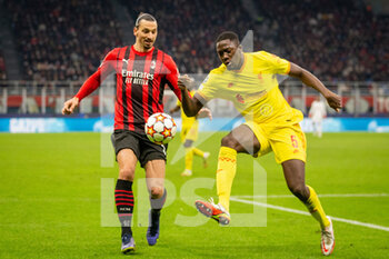 2021-12-07 - Zlatan Ibrahimovic of AC Milan and Ibrahima Konate of Liverpool during the UEFA Champions League, Group B football match between AC Milan and Liverpool FC on December 7, 2021 at San Siro Stadium in Milan, Italy - AC MILAN VS LIVERPOOL FC - UEFA CHAMPIONS LEAGUE - SOCCER