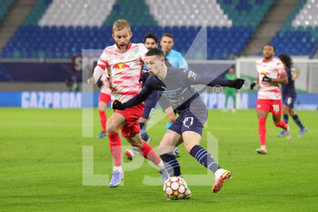 2021-12-07 - Phil Foden (47) of Manchester City battles with Konrad Laimer (27) of RB Leipzig during the UEFA Champions League, Group A football match between RB Leipzig and Manchester City on December 7, 2021 at Red Bull Arena in Leipzig, Germany - RB LEIPZIG VS MANCHESTER CITY - UEFA CHAMPIONS LEAGUE - SOCCER