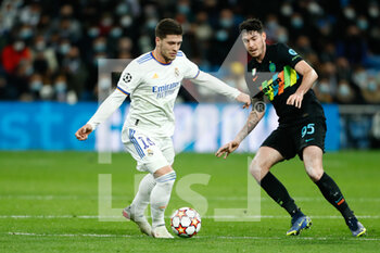 2021-12-07 - Luka Jovic of Real Madrid and Alessandro Bastoni of Inter during the UEFA Champions League, Group D football match between Real Madrid and FC Internazionale on December 7, 2021 at Santiago Bernabeu stadium in Madrid, Spain - REAL MADRID VS FC INTERNAZIONALE - UEFA CHAMPIONS LEAGUE - SOCCER