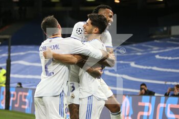 2021-12-07 - Marco Asensio of Real Madrid celebrates after his goal with Dani Carvajal and Eder Militao during the UEFA Champions League, Group D football match between Real Madrid and FC Internazionale on December 7, 2021 at Santiago Bernabeu stadium in Madrid, Spain - REAL MADRID VS FC INTERNAZIONALE - UEFA CHAMPIONS LEAGUE - SOCCER