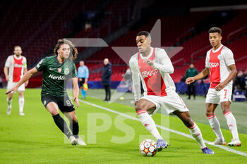 2021-12-07 - Ryan Gravenberch of Ajax during the UEFA Champions League, Group C football match between Ajax and Sporting Clube de Portugal on December 7, 2021 at Johan Cruijff ArenA in Amsterdam, Netherlands - AJAX VS SPORTING CLUBE DE PORTUGAL - UEFA CHAMPIONS LEAGUE - SOCCER