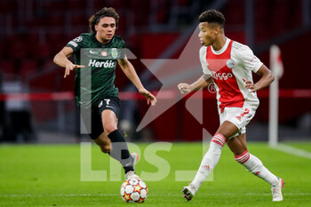 2021-12-07 - Goncalo Esteves of Sporting CP and David Neres of Ajax during the UEFA Champions League, Group C football match between Ajax and Sporting Clube de Portugal on December 7, 2021 at Johan Cruijff ArenA in Amsterdam, Netherlands - AJAX VS SPORTING CLUBE DE PORTUGAL - UEFA CHAMPIONS LEAGUE - SOCCER