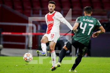 2021-12-07 - Noussair Mazraoui of Ajax and Ricardo Esgaio of Sporting CP during the UEFA Champions League, Group C football match between Ajax and Sporting Clube de Portugal on December 7, 2021 at Johan Cruijff ArenA in Amsterdam, Netherlands - AJAX VS SPORTING CLUBE DE PORTUGAL - UEFA CHAMPIONS LEAGUE - SOCCER