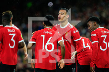 2021-12-08 - MANCHESTER, ENGLAND - DECEMBER 08: Mason Greenwood of Manchester United celebrating his goal with his teammates during the UEFA Champions League group F match between Manchester United and BSC Young Boys at Old Trafford on December 8, 2021 in Manchester, United Kingdom. - MANCHESTER UNITED VS BSC YOUNG BOYS - UEFA CHAMPIONS LEAGUE - SOCCER