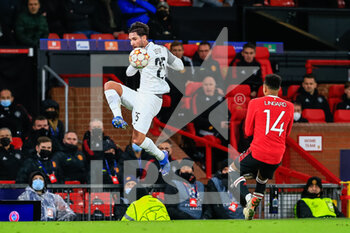 2021-12-08 - MANCHESTER, ENGLAND - DECEMBER 08: Jordan Lefort of Young Boys (L) fights for the ball with Jesse Lingard of Manchester United (R) during the UEFA Champions League group F match between Manchester United and BSC Young Boys at Old Trafford on December 8, 2021 in Manchester, United Kingdom. - MANCHESTER UNITED VS BSC YOUNG BOYS - UEFA CHAMPIONS LEAGUE - SOCCER