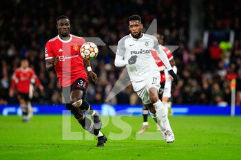 2021-12-08 - MANCHESTER, ENGLAND - DECEMBER 08: Jordan Siebatcheu of Young Boys (R) against Eric Bailly of Manchester United (L) during the UEFA Champions League group F match between Manchester United and BSC Young Boys at Old Trafford on December 8, 2021 in Manchester, United Kingdom. - MANCHESTER UNITED VS BSC YOUNG BOYS - UEFA CHAMPIONS LEAGUE - SOCCER