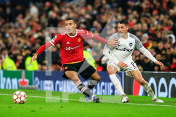 2021-12-08 - MANCHESTER, ENGLAND - DECEMBER 08: Mason Greenwood of Manchester United (L) against Vincent Sierro of Young Boys (R) during the UEFA Champions League group F match between Manchester United and BSC Young Boys at Old Trafford on December 8, 2021 in Manchester, United Kingdom. - MANCHESTER UNITED VS BSC YOUNG BOYS - UEFA CHAMPIONS LEAGUE - SOCCER