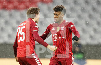 2021-12-08 - Thomas Muller of Bayern Munich celebrates his goal 1-0 with Kingsley Coman during the UEFA Champions League, Group E football match between Bayern Munich and FC Barcelona on December 8, 2021 at Allianz Arena in Munich, Germany - BAYERN MUNICH VS FC BARCELONA - UEFA CHAMPIONS LEAGUE - SOCCER