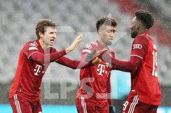 2021-12-08 - Thomas Muller of Bayern Munich celebrates his goal 1-0 with Kingsley Coman, Alphonso Davies during the UEFA Champions League, Group E football match between Bayern Munich and FC Barcelona on December 8, 2021 at Allianz Arena in Munich, Germany - BAYERN MUNICH VS FC BARCELONA - UEFA CHAMPIONS LEAGUE - SOCCER