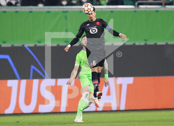 2021-12-08 - Jose Fonte of Lille and Wout Weghorst of Wolfsburg during the UEFA Champions League, Group G football match between VfL Wolfsburg and LOSC Lille on December 8, 2021 at Volkswagen Arena in Wolfsburg, Germany - VFL WOLFSBURG VS LOSC LILLE - UEFA CHAMPIONS LEAGUE - SOCCER