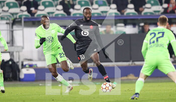 2021-12-08 - Jonathan Ikone of Lille and Josuha Guilavogui of Wolfsburg during the UEFA Champions League, Group G football match between VfL Wolfsburg and LOSC Lille on December 8, 2021 at Volkswagen Arena in Wolfsburg, Germany - VFL WOLFSBURG VS LOSC LILLE - UEFA CHAMPIONS LEAGUE - SOCCER