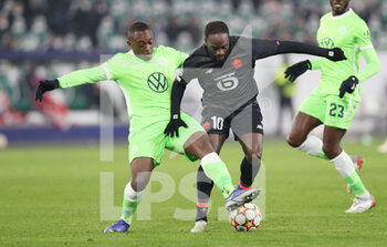 2021-12-08 - Jonathan Ikone of Lille and Jerome Roussillon of Wolfsburg during the UEFA Champions League, Group G football match between VfL Wolfsburg and LOSC Lille on December 8, 2021 at Volkswagen Arena in Wolfsburg, Germany - VFL WOLFSBURG VS LOSC LILLE - UEFA CHAMPIONS LEAGUE - SOCCER