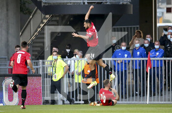 2021-09-16 - Gaetan Laborde of Rennes celebrates the goal of Flavien Tait (below) during the UEFA Europa Conference League, Group Stage, Group G football match between Stade Rennais and Tottenham Hotspur on September 16, 2021 at Roazhon Park stadium in Rennes, France - STADE RENNAIS VS TOTTENHAM HOTSPUR - UEFA CONFERENCE LEAGUE - SOCCER