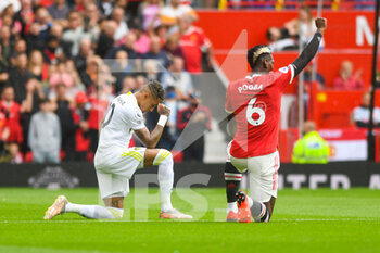 2021-08-14 - Leeds United forward Raphinha (10) and Manchester United midfielder Paul Pogba (6) take the knee during the English championship Premier League football match between Manchester United and Leeds United on August 14, 2021 at Old Trafford in Manchester, England - Photo Malcolm Bryce / ProSportsImages / DPPI - MANCHESTER UNITED VS LEEDS UNITED - ENGLISH PREMIER LEAGUE - SOCCER