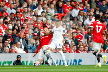 2021-08-14 - Leeds United forward Raphinha and Luke Shaw of Manchester United during the English championship Premier League football match between Manchester United and Leeds United on August 14, 2021 at Old Trafford in Manchester, England - Photo Simon Davies / ProSportsImages / DPPI - MANCHESTER UNITED VS LEEDS UNITED - ENGLISH PREMIER LEAGUE - SOCCER