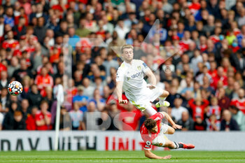 2021-08-14 - Leeds United forward Patrick Bamford (9) is tackled by Daniel James of Manchester United during the English championship Premier League football match between Manchester United and Leeds United on August 14, 2021 at Old Trafford in Manchester, England - Photo Simon Davies / ProSportsImages / DPPI - MANCHESTER UNITED VS LEEDS UNITED - ENGLISH PREMIER LEAGUE - SOCCER