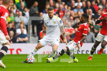 2021-08-14 - Leeds United midfielder Mateusz Klich and Fred of Manchester United during the English championship Premier League football match between Manchester United and Leeds United on August 14, 2021 at Old Trafford in Manchester, England - Photo Malcolm Bryce / ProSportsImages / DPPI - MANCHESTER UNITED VS LEEDS UNITED - ENGLISH PREMIER LEAGUE - SOCCER