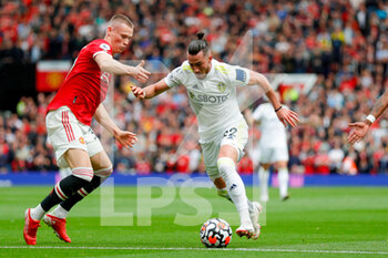 2021-08-14 - Leeds United midfielder Jack Harrison and Manchester United midfielder Scott McTominay during the English championship Premier League football match between Manchester United and Leeds United on August 14, 2021 at Old Trafford in Manchester, England - Photo Simon Davies / ProSportsImages / DPPI - MANCHESTER UNITED VS LEEDS UNITED - ENGLISH PREMIER LEAGUE - SOCCER