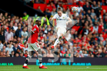 2021-08-14 - Leeds United defender Luke Ayling, Paul Pogba of Manchester United during the English championship Premier League football match between Manchester United and Leeds United on August 14, 2021 at Old Trafford in Manchester, England - Photo Simon Davies / ProSportsImages / DPPI - MANCHESTER UNITED VS LEEDS UNITED - ENGLISH PREMIER LEAGUE - SOCCER