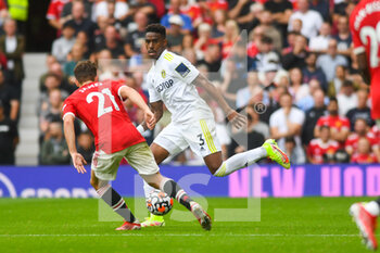 2021-08-14 - Leeds United defender Junior Firpo during the English championship Premier League football match between Manchester United and Leeds United on August 14, 2021 at Old Trafford in Manchester, England - Photo Malcolm Bryce / ProSportsImages / DPPI - MANCHESTER UNITED VS LEEDS UNITED - ENGLISH PREMIER LEAGUE - SOCCER