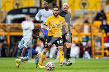 2021-08-29 - Joao Moutinho of Wolverhampton Wanderers passes ball past Manchester Utd midfielder Fred during the English championship Premier League football match between Wolverhampton Wanderers and Manchester United on August 29, 2021 at Molineux in Wolverhampton, England - Photo Manjit Narotra / ProSportsImages / DPPI - WOLVERHAMPTON WANDERERS VS MANCHESTER UNITED - ENGLISH PREMIER LEAGUE - SOCCER