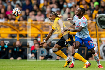 2021-08-29 - Adama Traore of Wolverhampton Wanderers battles for possession with Manchester Utd defender Aaron Wan-Bissaka during the English championship Premier League football match between Wolverhampton Wanderers and Manchester United on August 29, 2021 at Molineux in Wolverhampton, England - Photo Manjit Narotra / ProSportsImages / DPPI - WOLVERHAMPTON WANDERERS VS MANCHESTER UNITED - ENGLISH PREMIER LEAGUE - SOCCER