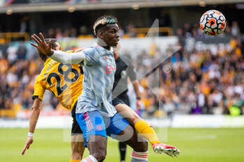 2021-08-29 - Manchester Utd midfielder Paul Pogba (6) battles for possession with Joao Moutinho of Wolverhampton during the English championship Premier League football match between Wolverhampton Wanderers and Manchester United on August 29, 2021 at Molineux in Wolverhampton, England - Photo Manjit Narotra / ProSportsImages / DPPI - WOLVERHAMPTON WANDERERS VS MANCHESTER UNITED - ENGLISH PREMIER LEAGUE - SOCCER
