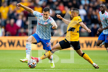 2021-08-29 - Manchester Utd defender Diogo Dalot (20) runs past Fernando Marcal of Wolverhampton during the English championship Premier League football match between Wolverhampton Wanderers and Manchester United on August 29, 2021 at Molineux in Wolverhampton, England - Photo Manjit Narotra / ProSportsImages / DPPI - WOLVERHAMPTON WANDERERS VS MANCHESTER UNITED - ENGLISH PREMIER LEAGUE - SOCCER