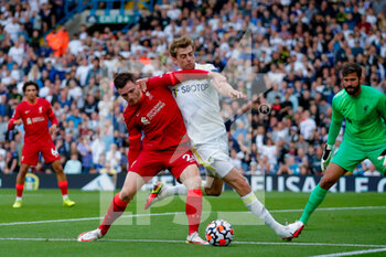 2021-09-12 - Liverpool defender Andrew Robertson (26) shields the ball out from Leeds United forward Patrick Bamford during the Premier League match between Leeds United and Liverpool at Elland Road, Leeds, England on 12 September 2021 - LEEDS UNITED VS LIVERPOOL AT ELLAND ROAD - ENGLISH PREMIER LEAGUE - SOCCER