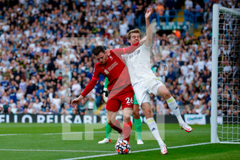 2021-09-12 - Liverpool defender Andrew Robertson (26) shields the ball out from Leeds United forward Patrick Bamford (9) during the Premier League match between Leeds United and Liverpool at Elland Road, Leeds, England on 12 September 2021 - LEEDS UNITED VS LIVERPOOL AT ELLAND ROAD - ENGLISH PREMIER LEAGUE - SOCCER