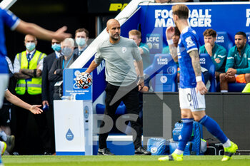 2021-09-11 - Manchester City Manager Pep Guardiola passes ball during the Premier League match between Leicester City and Manchester City at the King Power Stadium, Leicester, England on 11 September 2021 - LEICESTER CITY VS MANCHESTER CITY - ENGLISH PREMIER LEAGUE - SOCCER