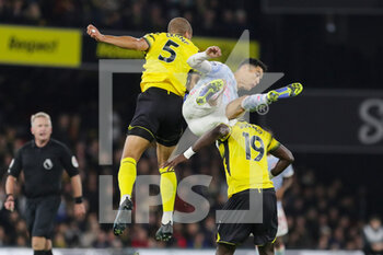 2021-11-21 - Watford defender William Troost-Ekong (5) heads and challenges with Manchester United Forward Cristiano Ronaldo (7), Watford Midfielder Moussa Sissoko during the English championship Premier League football match between Watford and Manchester United on November 20, 2021 at Vicarage Road in Watford, England - WATFORD VS MANCHESTER UNITED - ENGLISH PREMIER LEAGUE - SOCCER