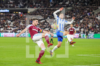 2021-12-01 - Declan Rice (41) of West Ham United and Adam Lallana (14) of Brighton during the English championship Premier League football match between West Ham United and Brighton and Hove Albion on December 1, 2021 at the London Stadium in London, England - WEST HAM UNITED VS BRIGHTON AND HOVE ALBION - ENGLISH PREMIER LEAGUE - SOCCER