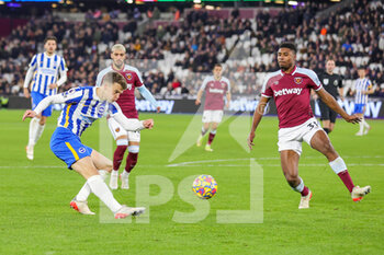 2021-12-01 - Solly March (20) of Brighton and Ben Johnson of West Ham during the English championship Premier League football match between West Ham United and Brighton and Hove Albion on December 1, 2021 at the London Stadium in London, England - WEST HAM UNITED VS BRIGHTON AND HOVE ALBION - ENGLISH PREMIER LEAGUE - SOCCER