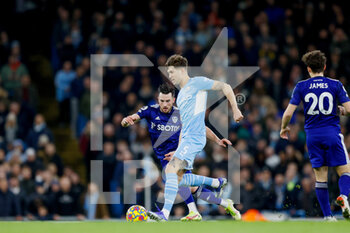 2021-12-14 - Manchester City defender John Stones and Leeds United midfielder Jack Harrison during the English championship Premier League football match between Manchester City and Leeds United on December 14, 2021 at the Etihad Stadium in Manchester, England - MANCHESTER CITY VS LEEDS UNITED - ENGLISH PREMIER LEAGUE - SOCCER