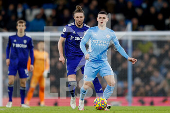 2021-12-14 - Manchester City midfielder Phil Foden and Leeds United defender Luke Ayling during the English championship Premier League football match between Manchester City and Leeds United on December 14, 2021 at the Etihad Stadium in Manchester, England - MANCHESTER CITY VS LEEDS UNITED - ENGLISH PREMIER LEAGUE - SOCCER