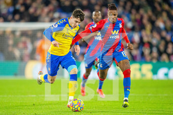 2021-12-15 - Crystal Palace forward Wilfried Zaha (11) battles with Southampton defender Tino Livramento (21) during the English championship Premier League football match between Crystal Palace and Southampton on December 15, 2021 at Selhurst Park in London, England - CRYSTAL PALACE VS SOUTHAMPTON - ENGLISH PREMIER LEAGUE - SOCCER