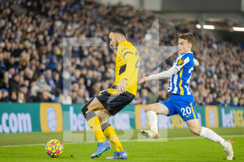 2021-12-15 - Wolverhampton Wanderers midfielder Romain Saiss (27) and Brighton and Hove Albion midfielder Solly March (20) during the English championship Premier League football match between Brighton and Hove Albion and Wolverhampton Wanderers on December 15, 2021 at the American Express Community Stadium in Brighton and Hove, England - BRIGHTON AND HOVE ALBION VS WOLVERHAMPTON WANDERERS - ENGLISH PREMIER LEAGUE - SOCCER