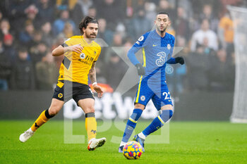 2021-12-19 - Ruben Neves (C) of Wolverhampton and Hakim Ziyech of Chelsea during the English championship Premier League football match between Wolverhampton Wanderers and Chelsea on December 19, 2021 at Molineux in Wolverhampton, England - WOLVERHAMPTON WANDERERS VS CHELSEA - ENGLISH PREMIER LEAGUE - SOCCER