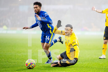 2021-12-19 - Chelsea defender Reece James (24) and Romain Saiss of Wolverhampton during the English championship Premier League football match between Wolverhampton Wanderers and Chelsea on December 19, 2021 at Molineux in Wolverhampton, England - WOLVERHAMPTON WANDERERS VS CHELSEA - ENGLISH PREMIER LEAGUE - SOCCER