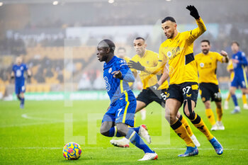 2021-12-19 - Chelsea midfielder N'Golo Kante and Romain Saiss of Wolverhampton during the English championship Premier League football match between Wolverhampton Wanderers and Chelsea on December 19, 2021 at Molineux in Wolverhampton, England - WOLVERHAMPTON WANDERERS VS CHELSEA - ENGLISH PREMIER LEAGUE - SOCCER