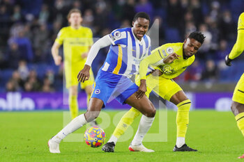 2021-12-27 - Brighton and Hove Albion midfielder Enock Mwepu (12) battles with Brentford midfielder Bryan Mbeumo (19) during the English championship Premier League football match between Brighton and Hove Albion and Brentford on December 26, 2021 at the American Express Community Stadium in Brighton and Hove, England - BRIGHTON AND HOVE ALBION VS BRENTFORD - ENGLISH PREMIER LEAGUE - SOCCER